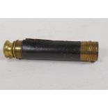 An antique brass three draw pocket telescope, 14" long open