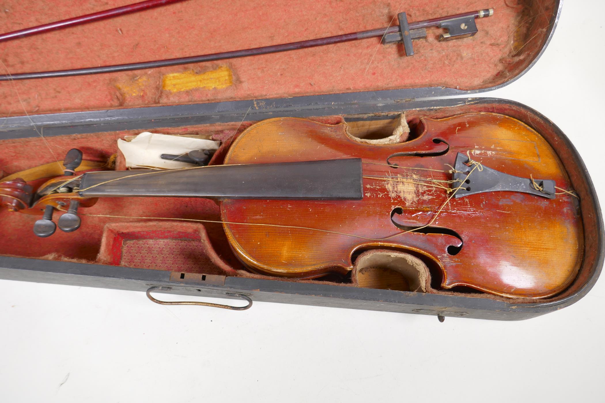 A vintage violin, 23½" long, with two bows, one marked Japan with chrysanthemum, in a fitted - Image 2 of 5