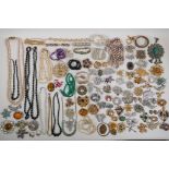 A quantity of good quality vintage costume jewellery to include necklaces, brooches, earrings etc