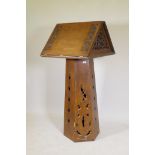 A Gothic style oak lectern, the tapering hexagonal shaped base with single door supporting a