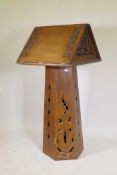 A Gothic style oak lectern, the tapering hexagonal shaped base with single door supporting a