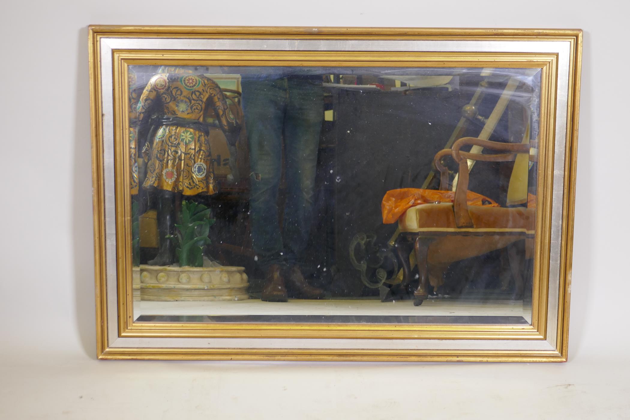 A gilt framed wall mirror, 40" x 28"
