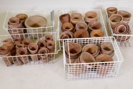 A quantity of terracotta garden flower pots
