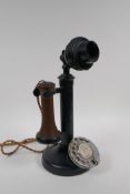 An antique rotary candlestick telephone, numbered to the reverse of the mouthpiece PL234 No.22, with