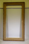 A large Victorian giltwood and composition picture frame, rebate 48" x 97"