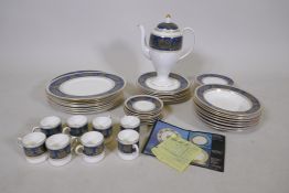 A Wedgwood blue and gold Columbia pattern eight place dinner service, little to no use