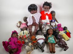 A collection of black dolls, largest 17" high