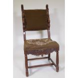 A walnut high back chair with Renaissance revival carved decoration, bears label Berick Furniture,