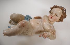 An antique plaster figure of a putto, very AF, 15" long