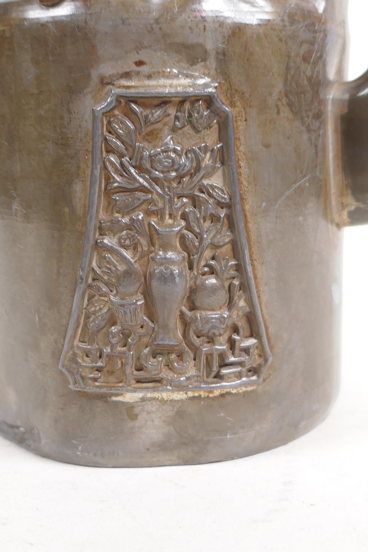 An antique Chinese pewter tea pot with applied decorative panels in relief and removable infuser/ - Image 2 of 6