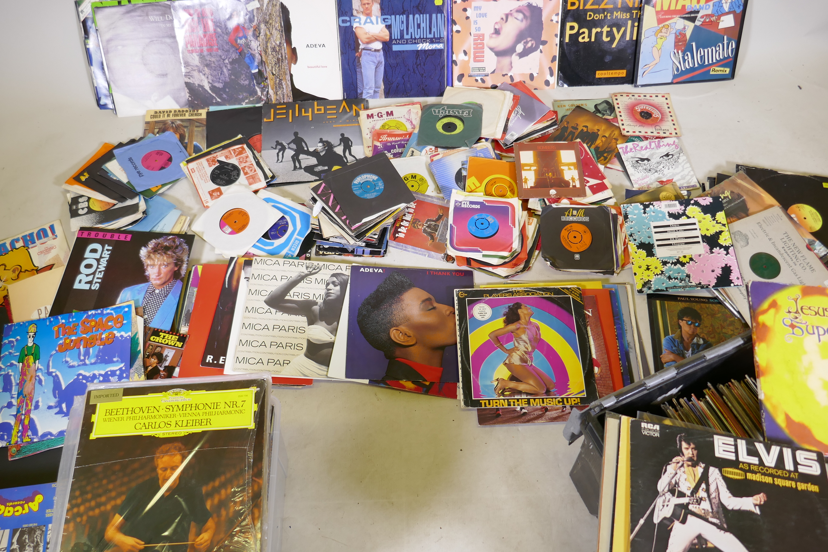 A large collection of records, 12", 10" singles, 7" singles and a quantity of LPs, classical, dance,