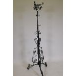 A C19th wrought iron oil lamp stand, AF, 62" high