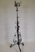 A C19th wrought iron oil lamp stand, AF, 62" high