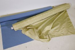 A roll of blue cotton canvas and a large roll of watered silk, 56" wide