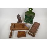 A collection of wooden wares including a vintage football rattle, eastern carved glove box, spice