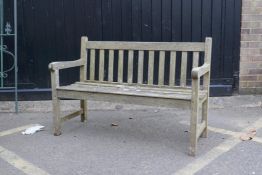 A teak slatted garden bench, 48" long