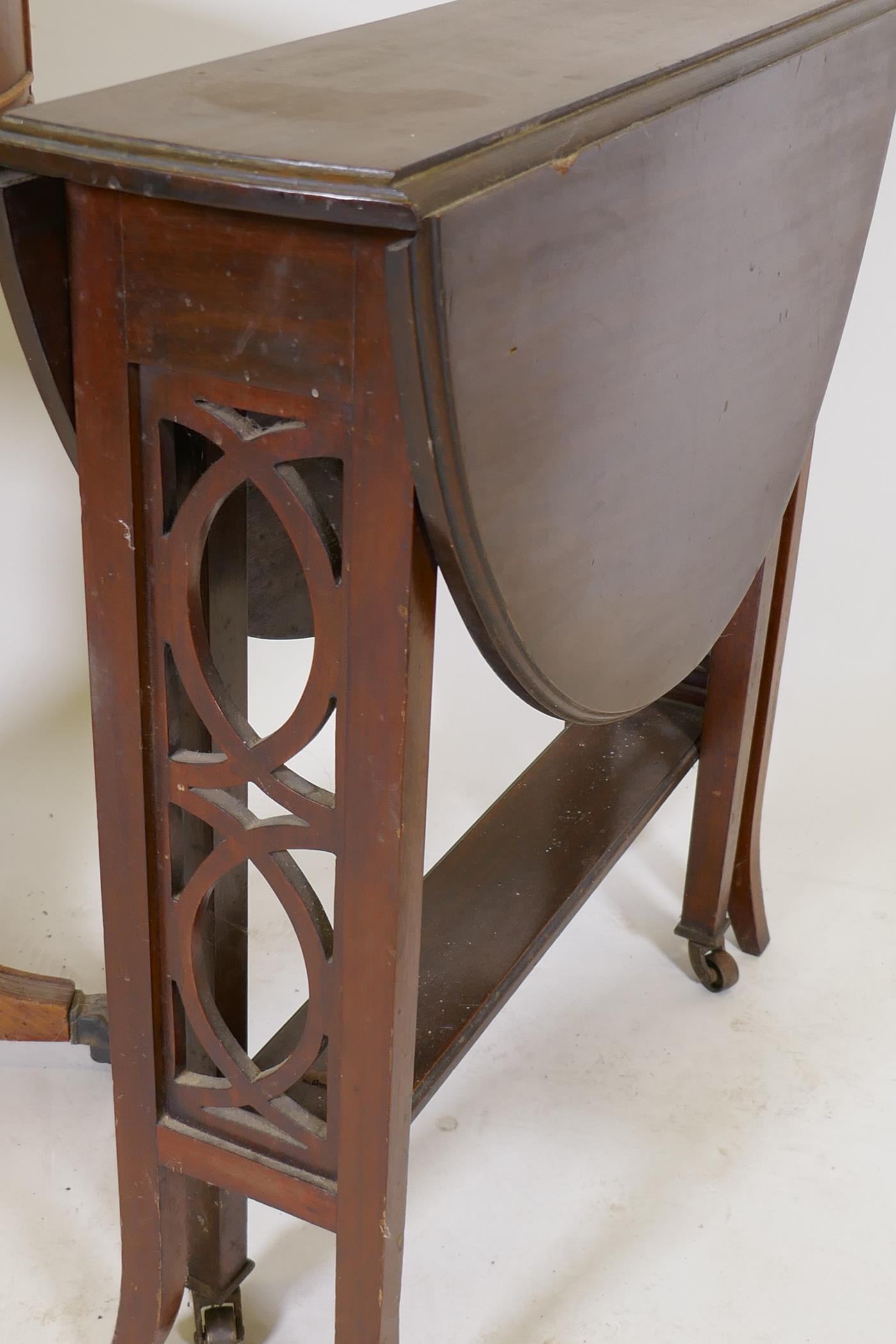 A small yew wood drum table with inset leather top, two true and four false drawers, raised on - Image 4 of 4