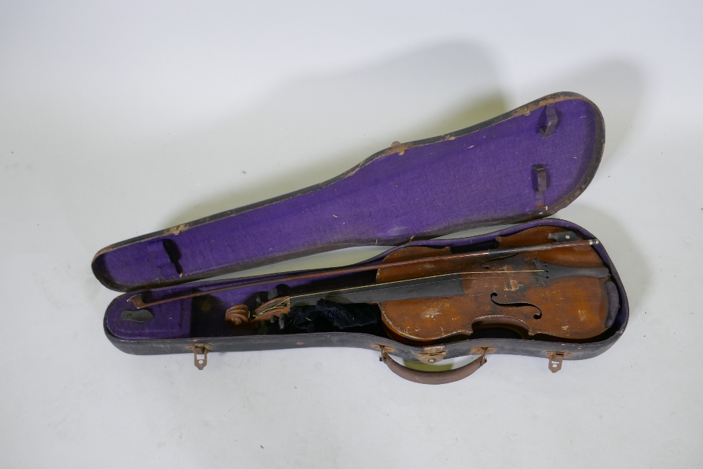 An antique violin in wood case, AF, and a bow, marked Dodd