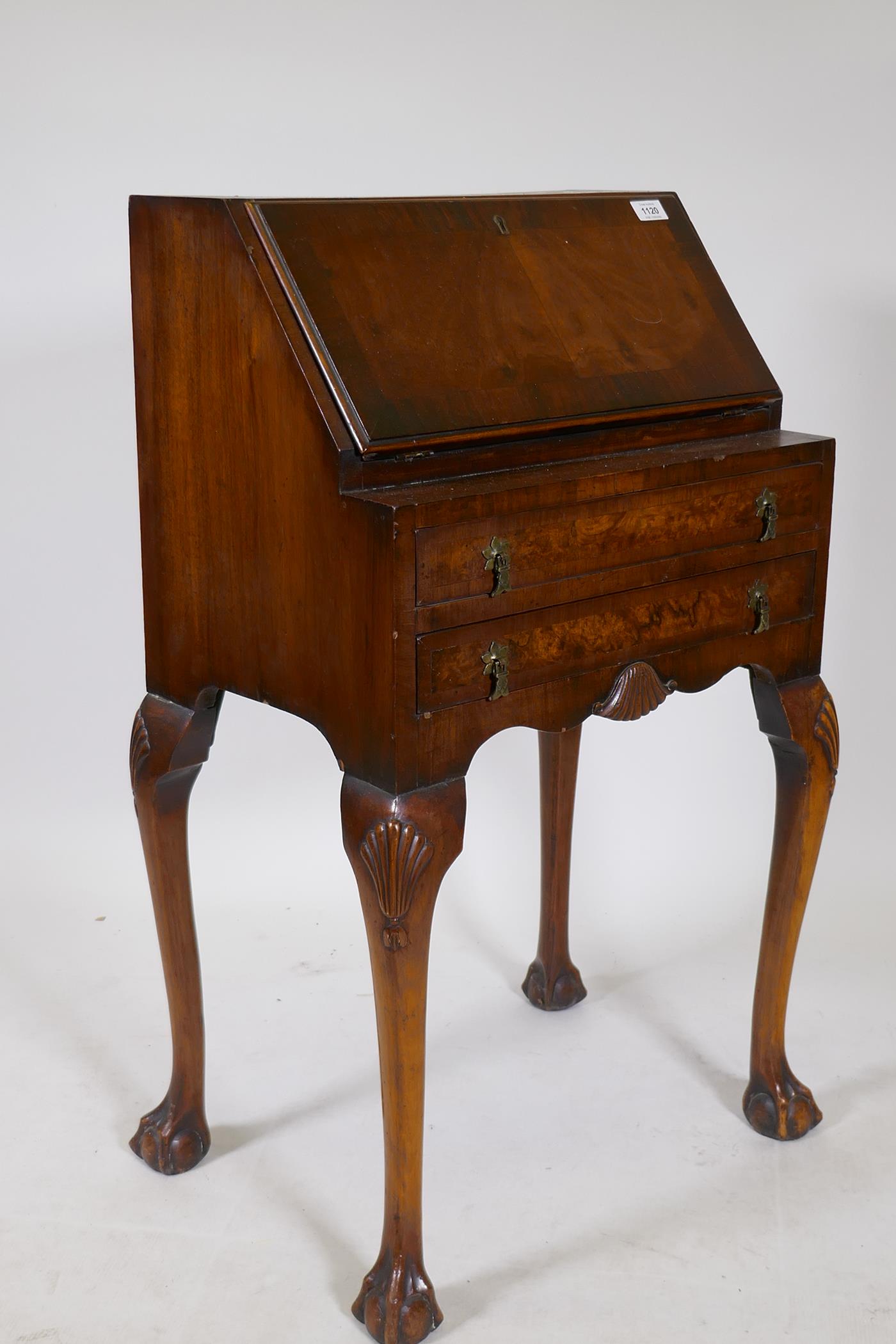 A 1920s Georgian style walnut fall front bureau with a fitted interior, two long drawers, cabriole - Image 3 of 3