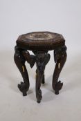 An Indian carved hardwood elephant leg table with an octagonal top and bone inlay, 18½" high