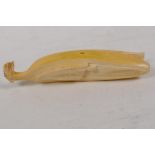 A Japanese carved bone okimono in the form of a banana, 5½" long