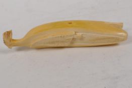 A Japanese carved bone okimono in the form of a banana, 5½" long