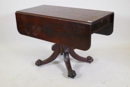 A C19th Cuban mahogany sofa table with a single end drawer, raised on a turned column, four