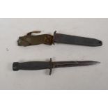A commando dagger in metal and leather sheath, 12" long