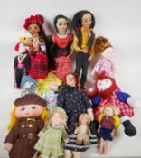 A quantity of fabric dolls including costumes