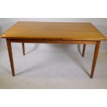 A mid century teak dining table with pull out leaves, 36" x 58" x 106"