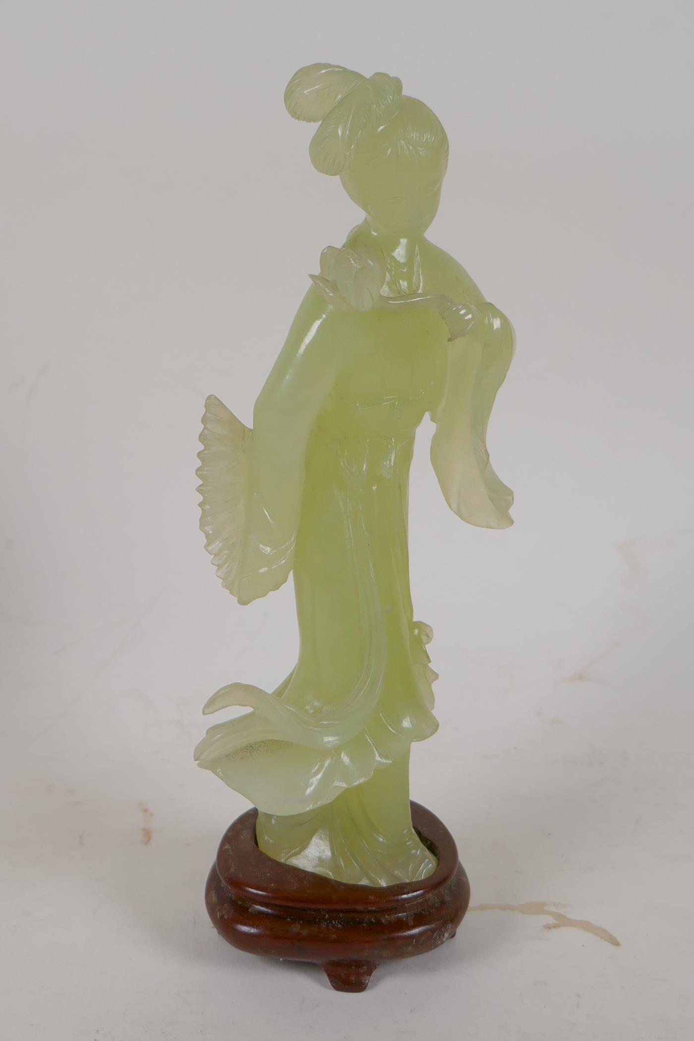 A carved greenstone figure of a Chinese lady, on a hardwood base, 8" high - Image 2 of 3