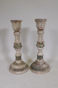 A pair of carved and painted wood candlesticks, 24½" high