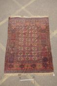 An antique brown ground wool Bokhara rug, 61" x 79"