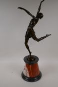 An Art Deco style bronze figure of an athletic girl on a marble socle, 25" high