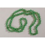 A string of small jade beads, 26" long