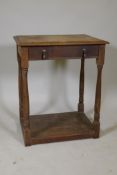 A C19th oak single drawer side table, raised on turned supports with a pot board, 24" x 18" x 29"