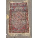 A Persian multi colour Heriz design silk rug, wear, 38½" x 60"