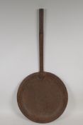 An Indian wrought iron frying strainer, 28" long