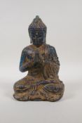 An oriental cast blue resin figure of Buddha, 9" high