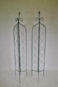 A pair of three fold iron garden obelisks, 72" high