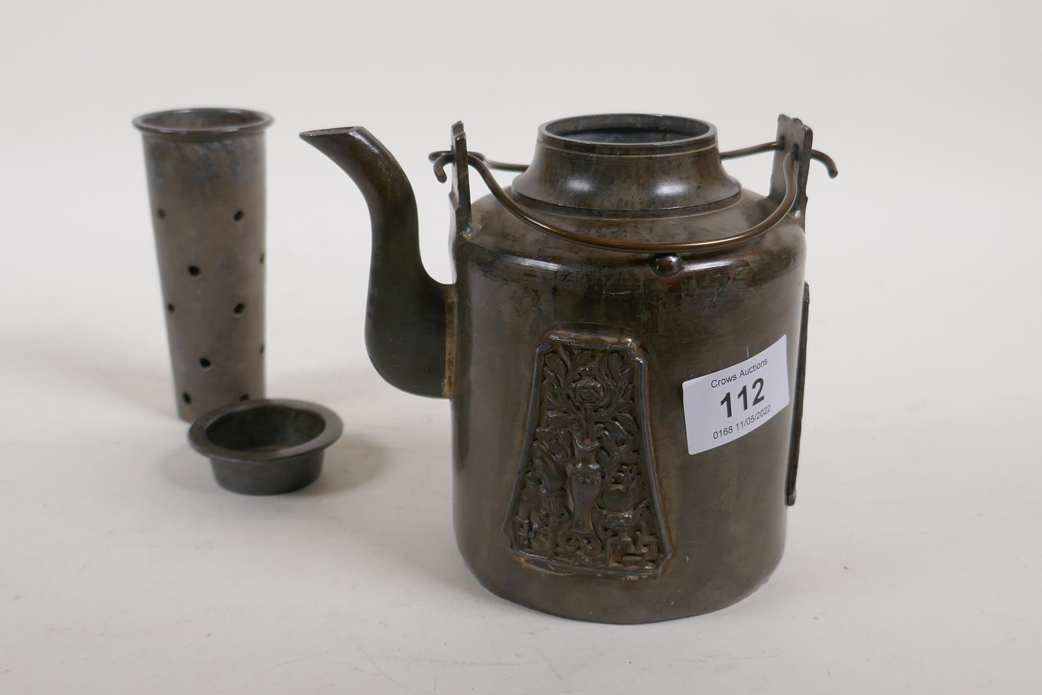 An antique Chinese pewter tea pot with applied decorative panels in relief and removable infuser/ - Image 6 of 6