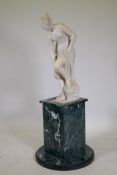 A cast and carved reconstituted marble figure of Venus, mounted on a vert de mer marble pedestal,