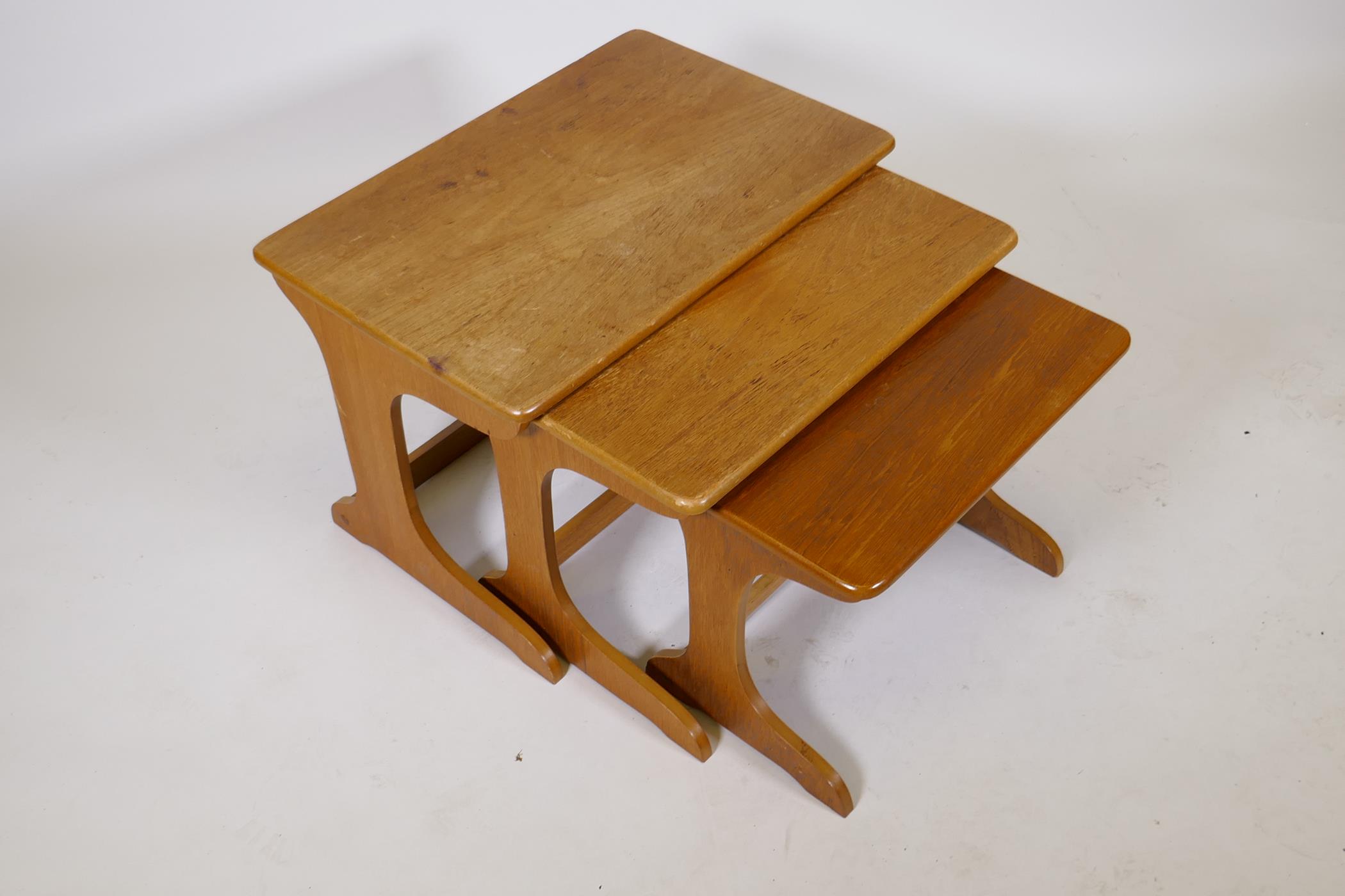 A nest of three mid century teak occasional tables, largest 23½" x 15½", 16½" high - Image 2 of 2