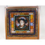 A a stained lass effect panel with a portrait of gentleman inscribed holbein, 20" x 19"