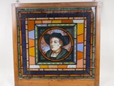 A a stained lass effect panel with a portrait of gentleman inscribed holbein, 20" x 19"