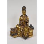 A Chinese filled bronze figure of Quan Yin seated on a kylin, impressed 6 character mark to base and