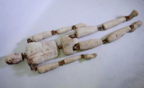 A lifesize stuffed calico dummy with wood joints, requiring re-fixing, 76" long