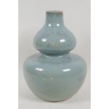 A celadon glazed studio pottery double gourd vase, 10" high