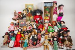 A quantity of costume dolls, many nations