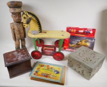 A vintage Triang toy horse, carved wooden soldier, Airfix helicopter kit, children's annual boxes